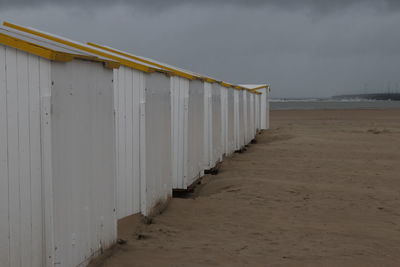 Beach huts against sky