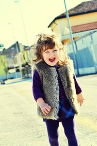 Happy girl walking on street