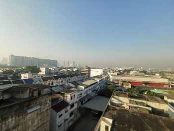 High angle view of buildings in city against clear sky