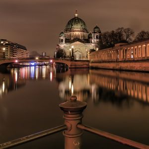 Reflection of illuminated buildings in water at night