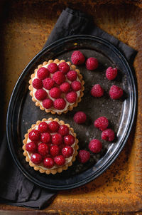 Directly above shot of tarts in tray on table