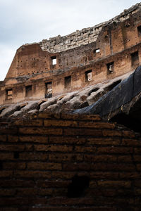 Low angle view of old building against sky