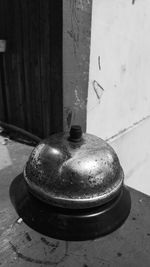 High angle view of old container on table against wall