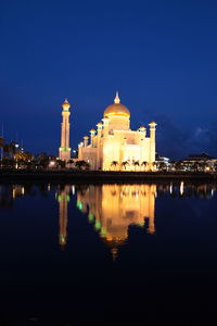 Reflection of illuminated buildings in water at night