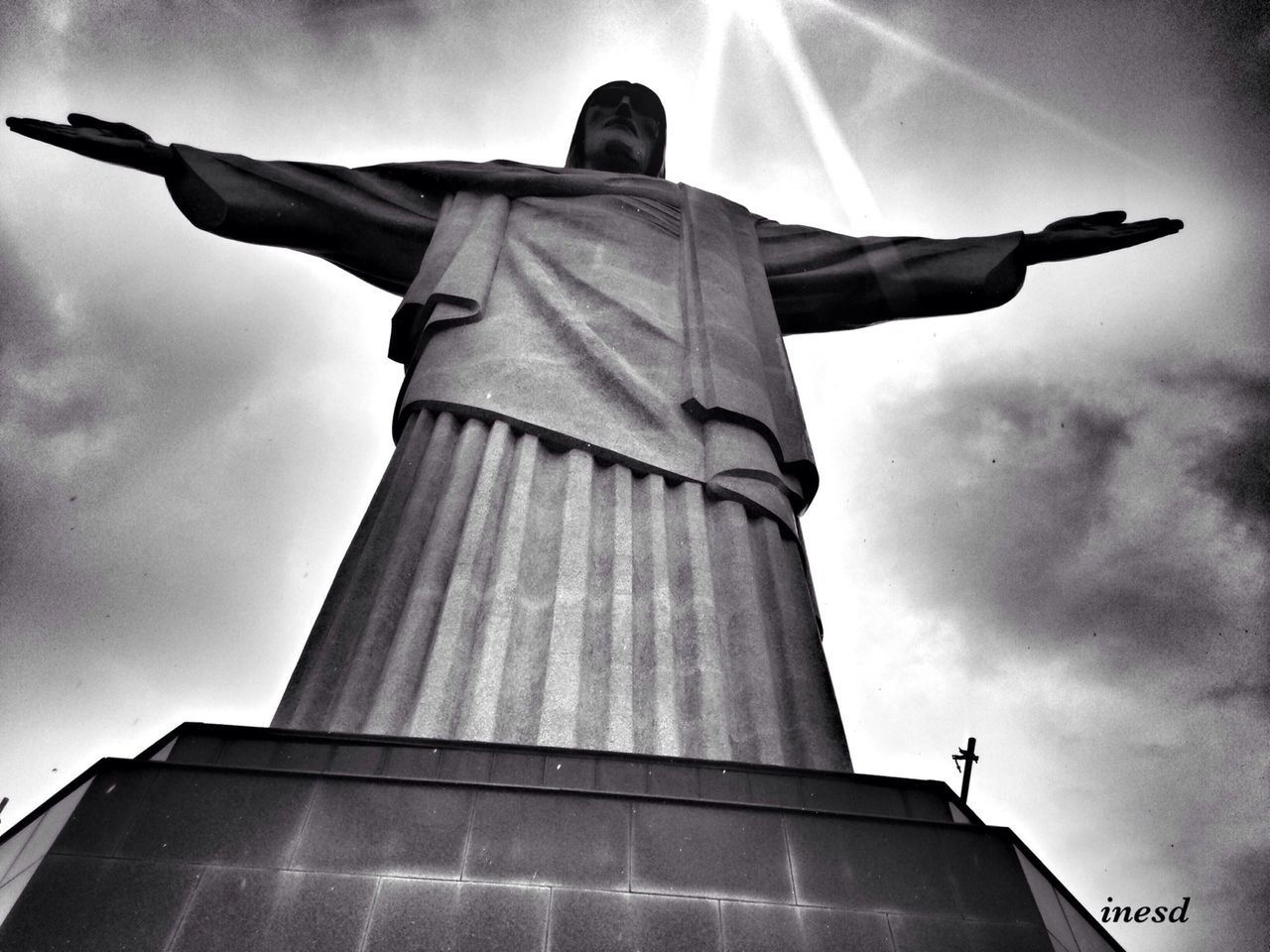 low angle view, sky, building exterior, built structure, architecture, religion, statue, cloud - sky, spirituality, sculpture, human representation, place of worship, church, cross, travel destinations, cloud, cloudy