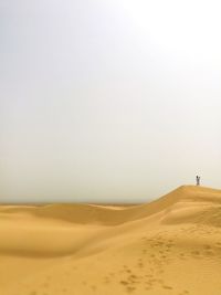 Scenic view of desert against clear sky