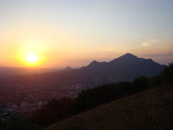 Scenic view of mountains against sky during sunset