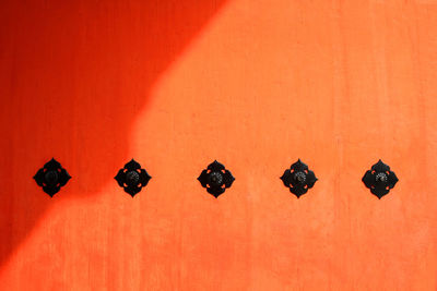 Orange wooden door or wall background with shadow