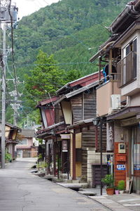 Street amidst houses and buildings in city