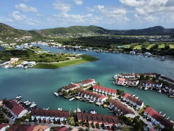 High angle view of townscape by sea