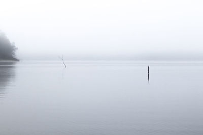 Scenic view of lake against sky during winter