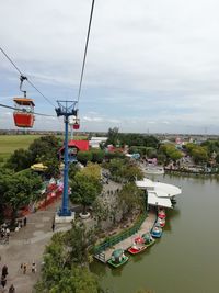 High angle view of boats in city against sky