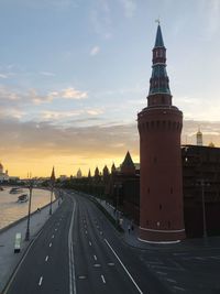 High angle view of road by buildings against sky during sunset