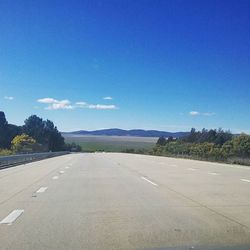 Empty road along landscape