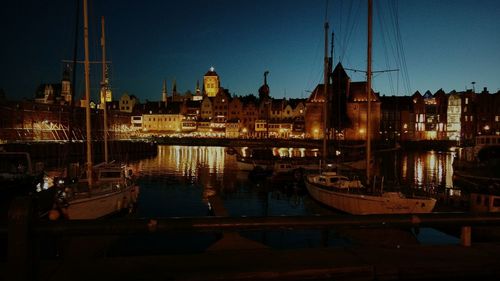 Boats moored at harbor