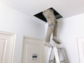 Low angle view of man working at home