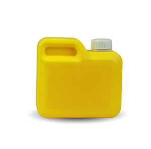 Close-up of yellow bottle against white background