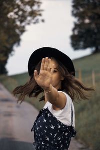 Low section of woman standing against the sky