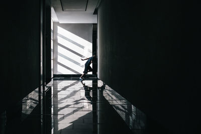 Silhouette man in corridor of building