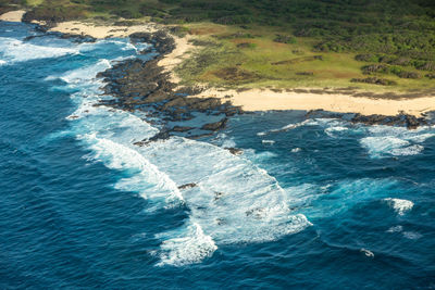 Aerial view of waves on beach