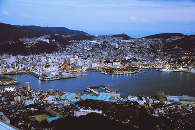 High angle view of townscape and boats in bay