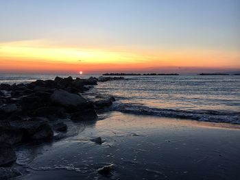 Scenic view of sea against sky during sunset