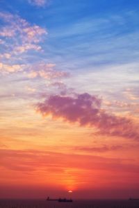 Low angle view of dramatic sky during sunset