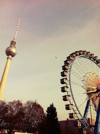 Low angle view of ferris wheel against sky