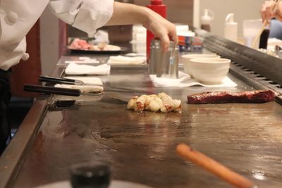 High angle view of people preparing food on table