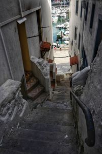 High angle view of staircase amidst buildings in city