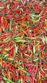 Full frame shot of red chili peppers for sale at market
