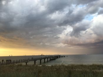 Scenic view of beach against sky during sunset