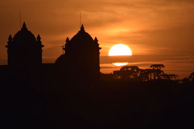 Sunset in a small brasilian city with a church in the background