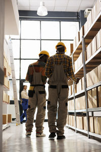 Rear view of man standing in building