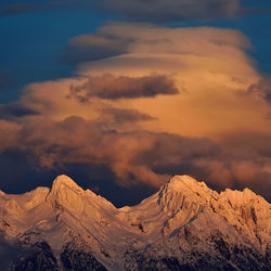 Scenic view of mountains against dramatic sky