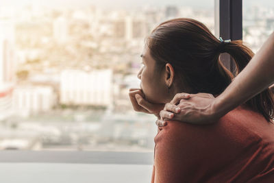 Rear view of woman looking at city