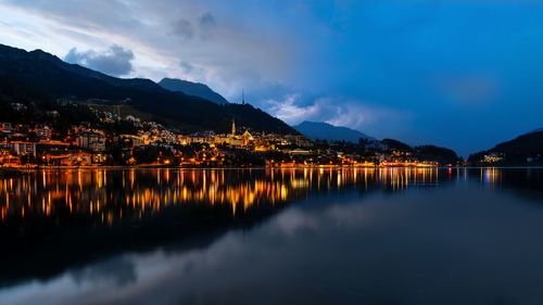 Scenic view of lake against sky at night