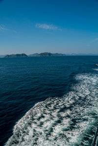 Scenic view of sea against blue sky