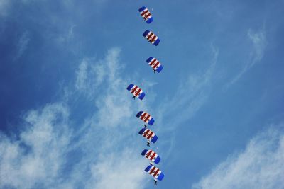 Low angle view of airshow against sky