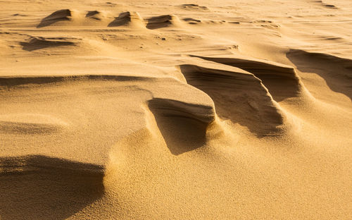 High angle view of sand dunes at beach