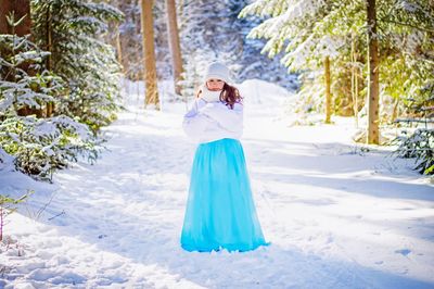 Woman with umbrella in snow