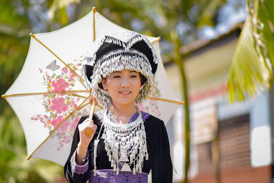 Portrait of a smiling girl standing outdoors