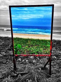 Scenic view of sea against cloudy sky