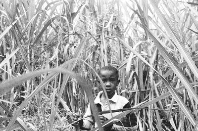 Close-up portrait of boy on grass