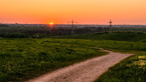 Scenic view of field against sky during sunset