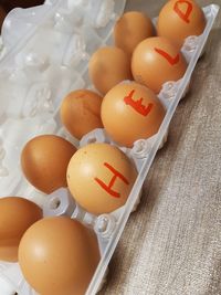 High angle view of eggs in container on table