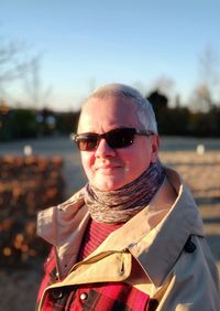 Portrait of man wearing sunglasses against sky