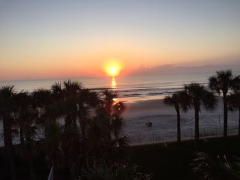 Scenic view of sea at sunset