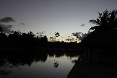 Scenic view of calm lake at sunset