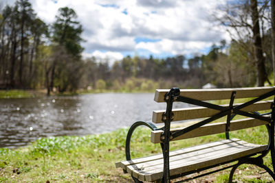 Close-up of railing against lake in park